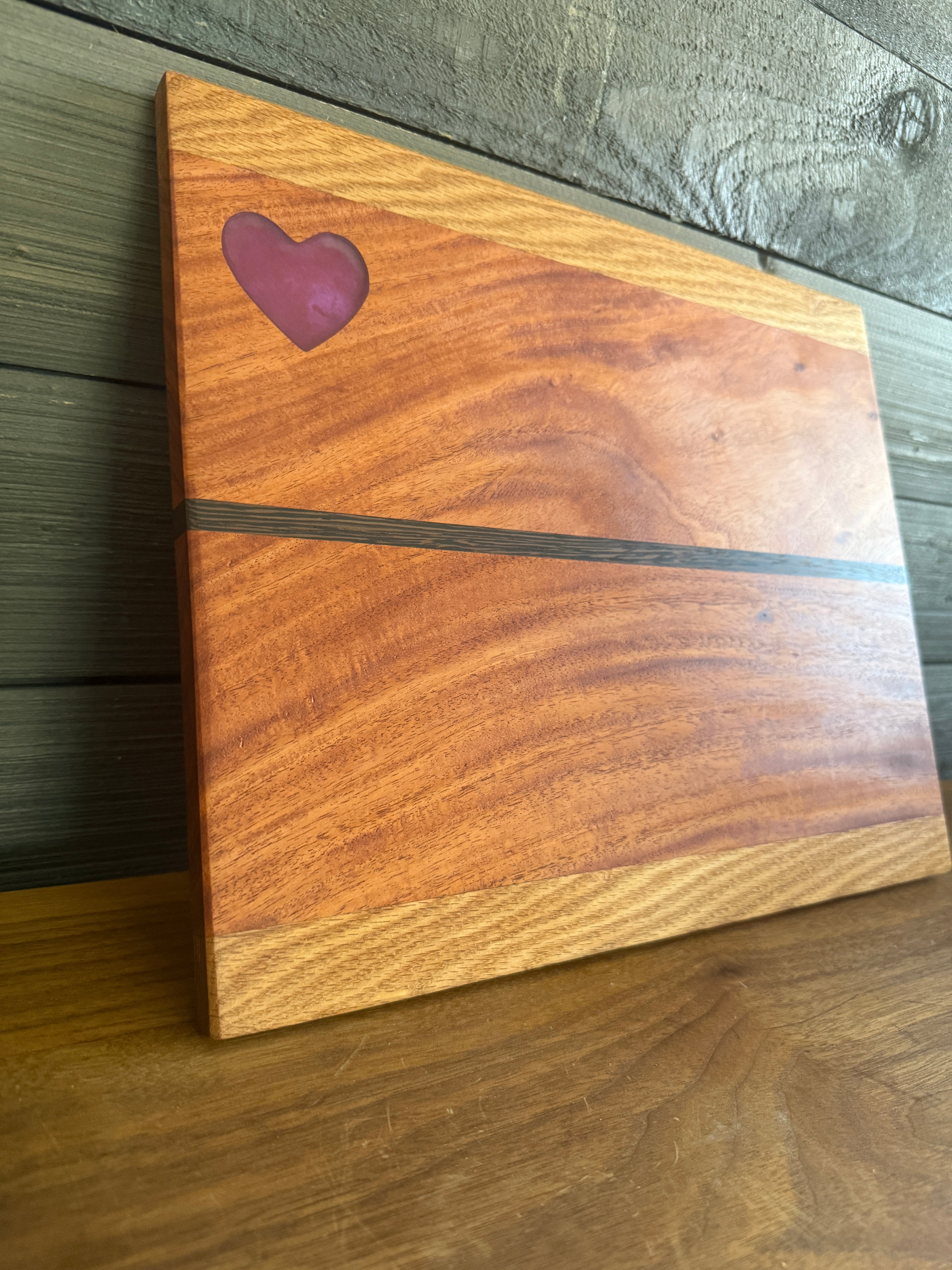 Red Heart epoxy Inlay with Padauk Wood Cutting Board, highlighted with a Strip of Wenge Wood.