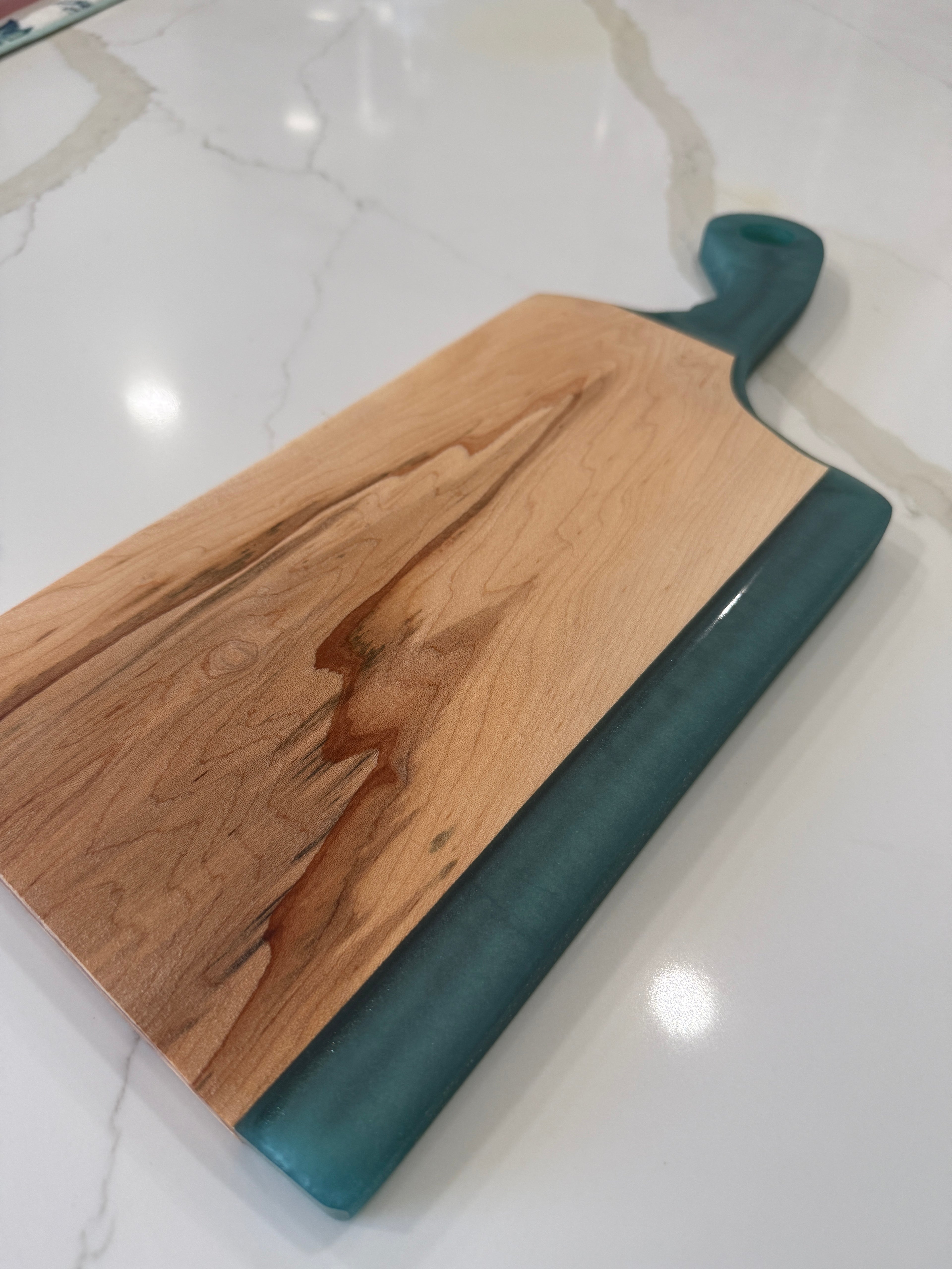 Teal Epoxy Handled Cutting Board with a Maple Cutting Surface.