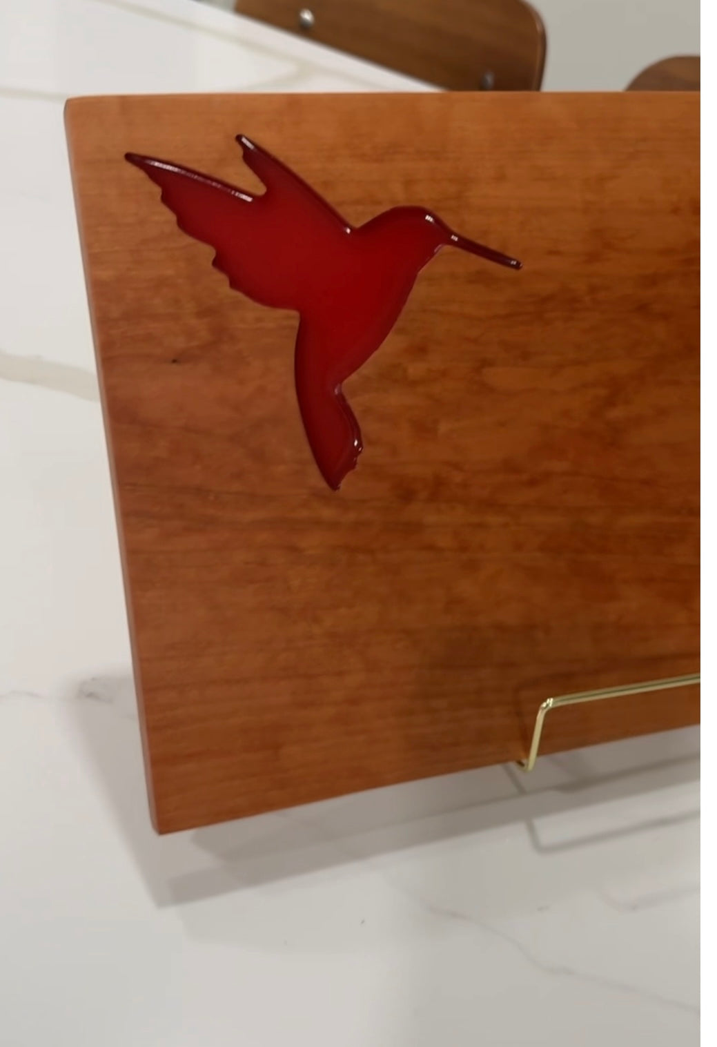 Red Hummingbird on Cherry Wood