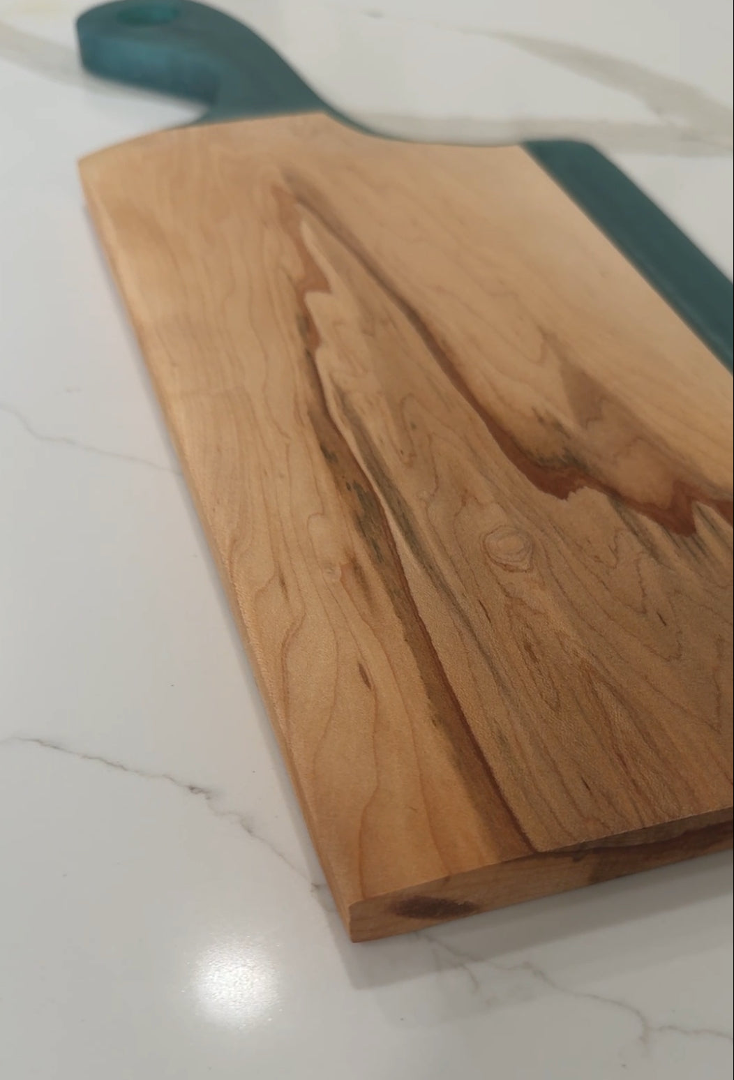 Teal Epoxy Handled Cutting Board with a Maple Cutting Surface.