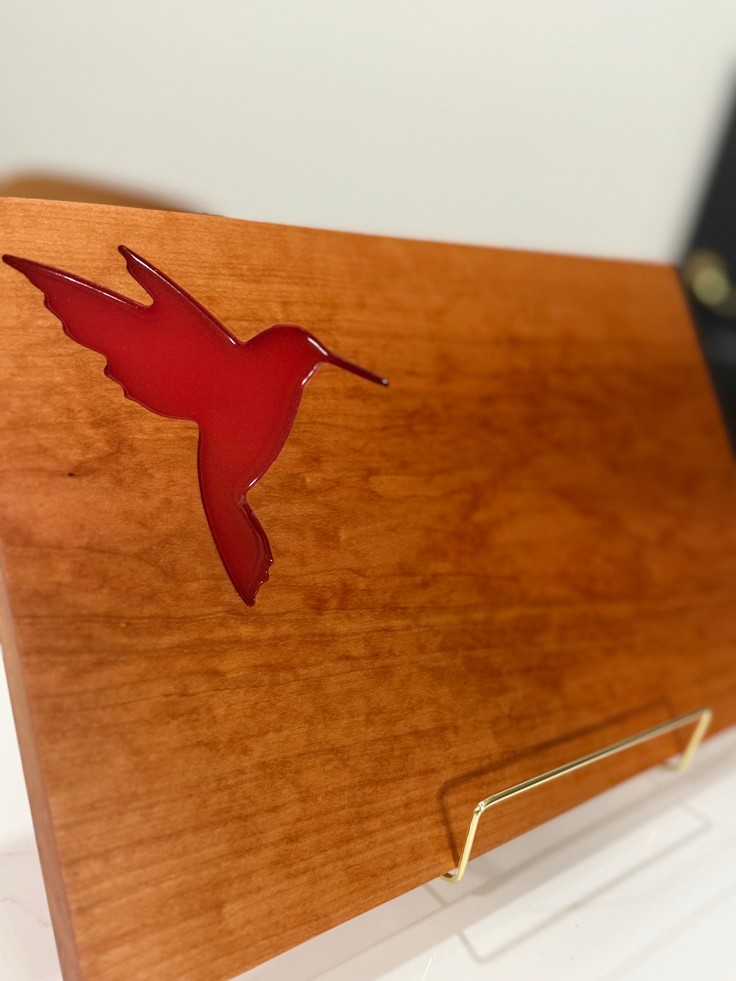 Red Hummingbird on Cherry Wood