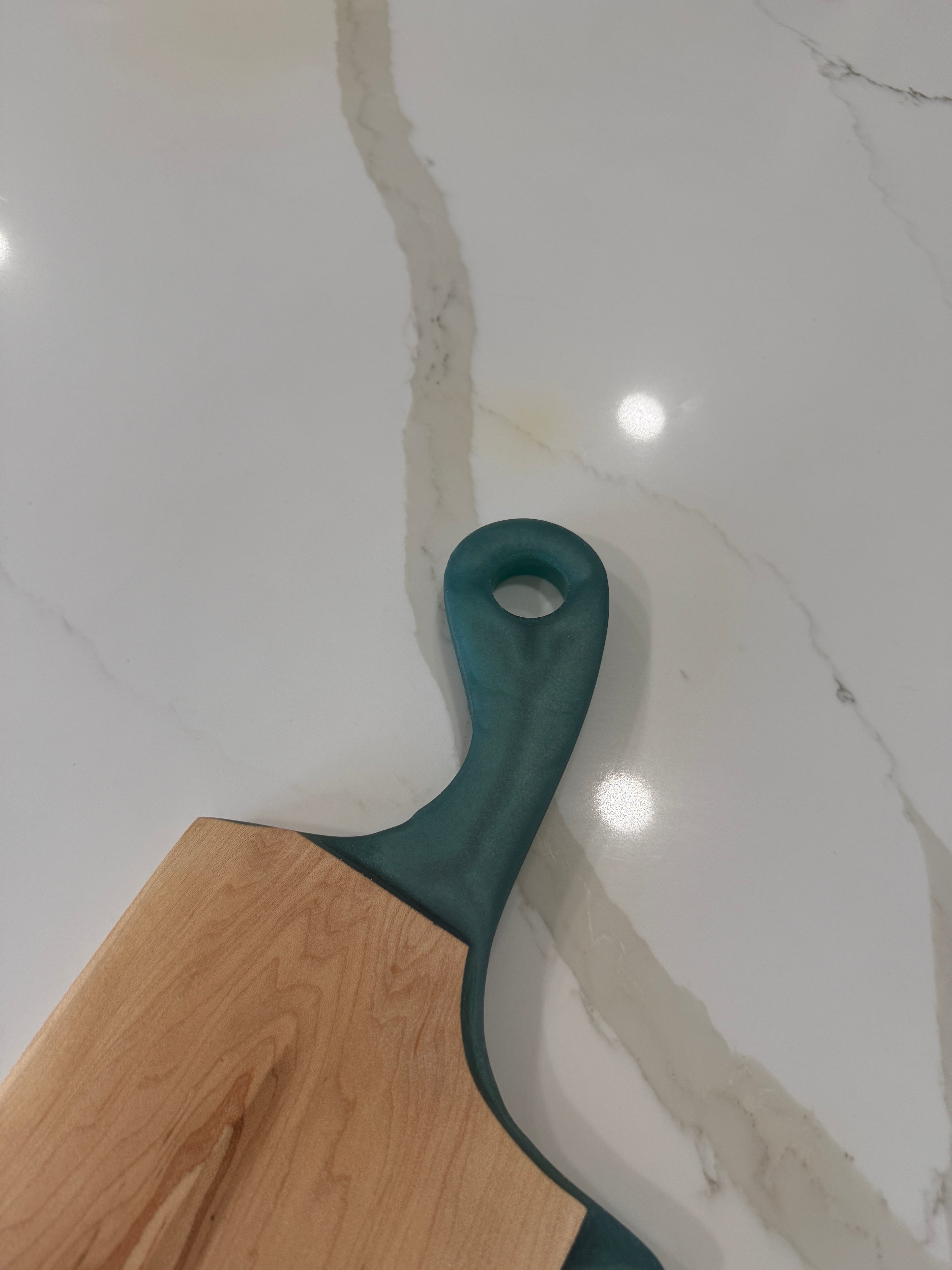 Teal Epoxy Handled Cutting Board with a Maple Cutting Surface.